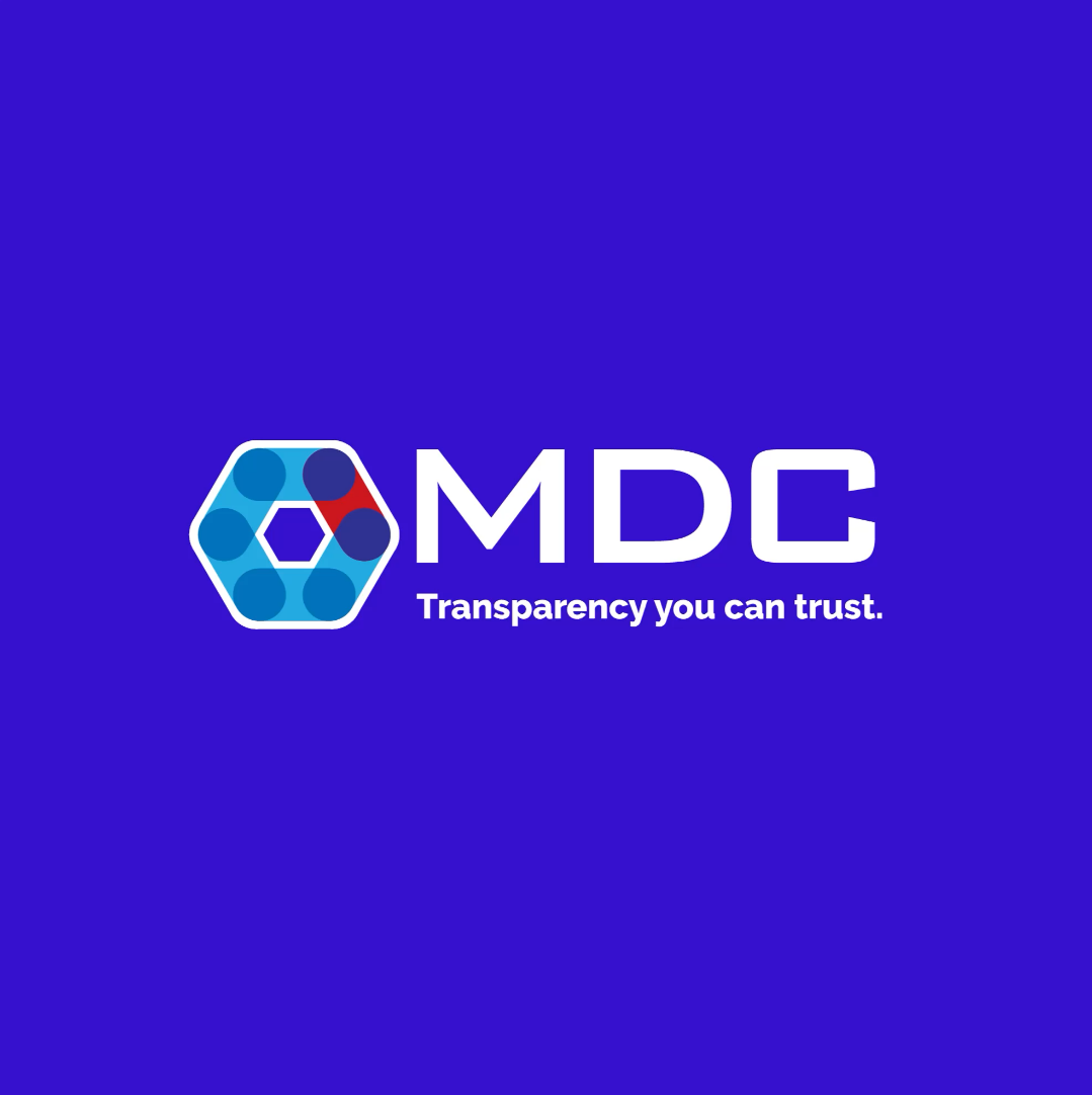 A corporate logo of "MDC" on a deep blue background, featuring a hexagonal design with interconnected patterns and the tagline "transparency you can trust," symbolizing MDC's