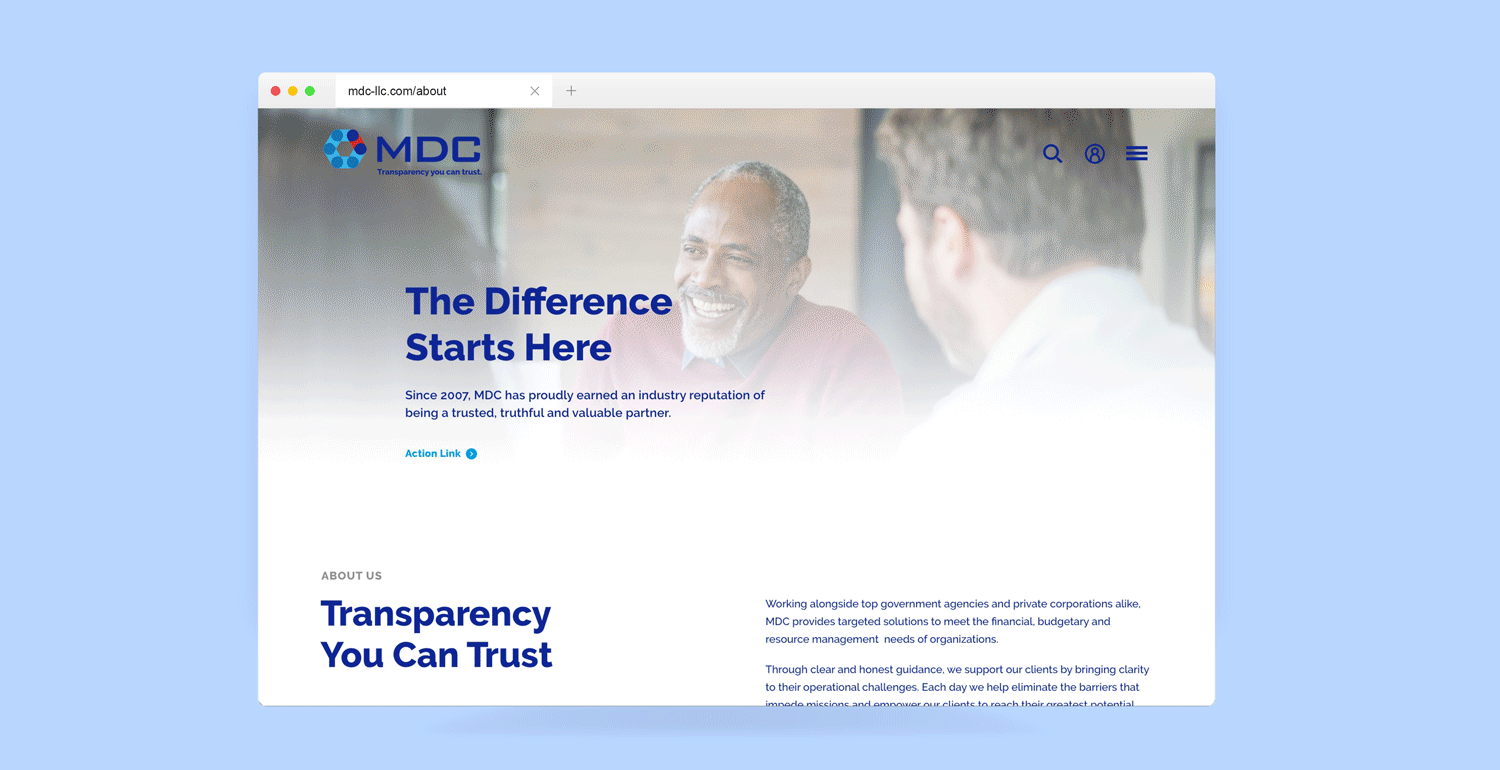 Web browser displaying the MDC business website with a banner headline reading "the difference transparency can make" featuring an image of a smiling man in discussion with another person.