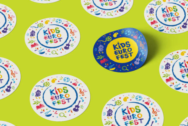 A vibrant and playful pattern featuring multiple colorful round logos for "DEU Kids Fest," set against a bright yellow background, suggesting a festive and child-friendly event.