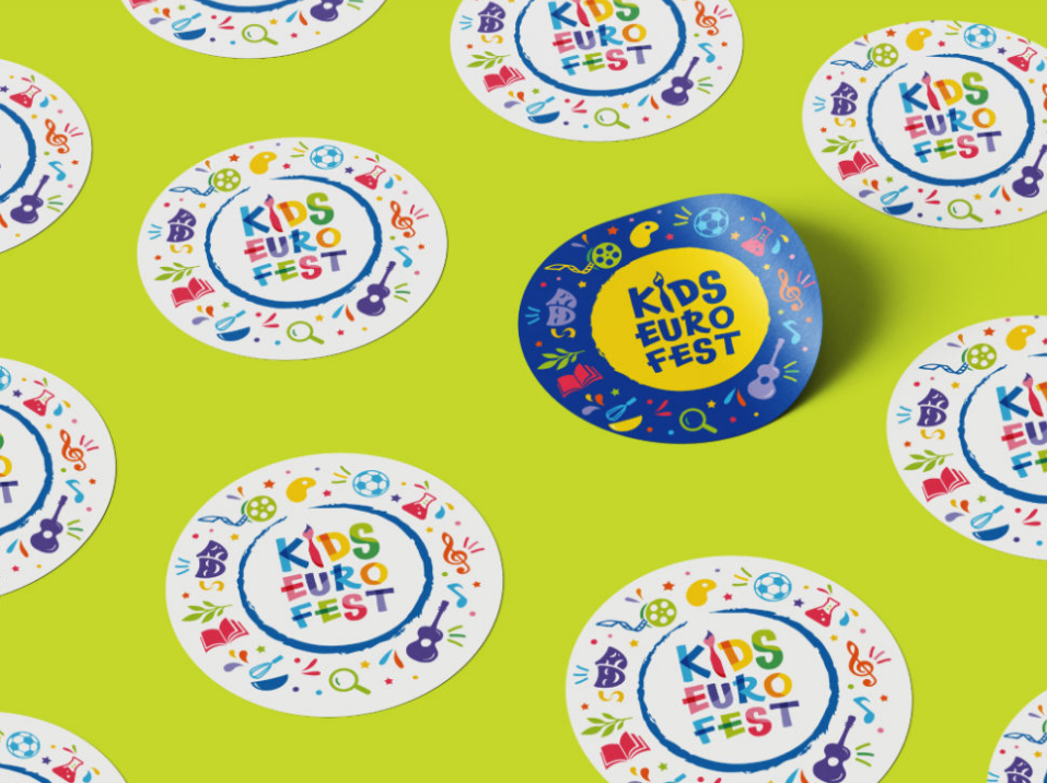 A vibrant and playful pattern featuring multiple colorful round logos for "DEU Kids Fest," set against a bright yellow background, suggesting a festive and child-friendly event.
