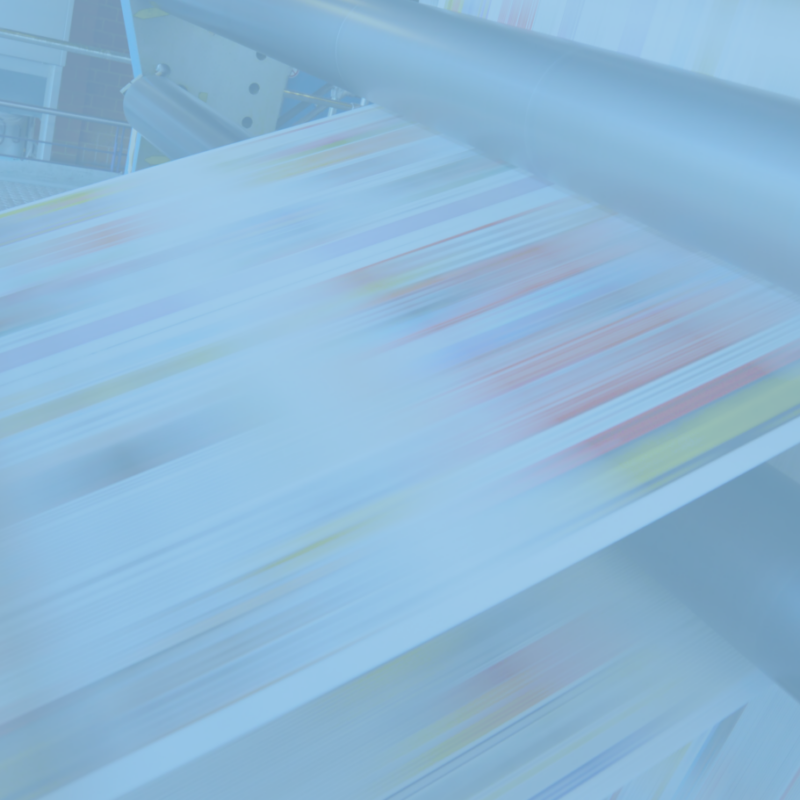 The large printing press whirs to life, swiftly producing colorful pages that blur across its rollers, echoing the vibrant pulse of direct mail trends to watch for in 2025. This high-speed printing process captures the dynamic evolution of print marketing.